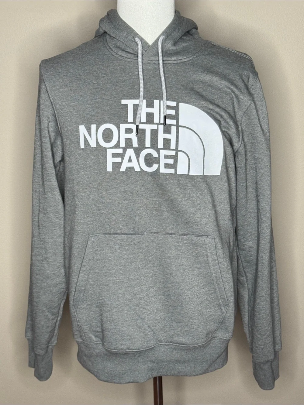 The North Face mens gray hooded sweatshirt size M with pockets.